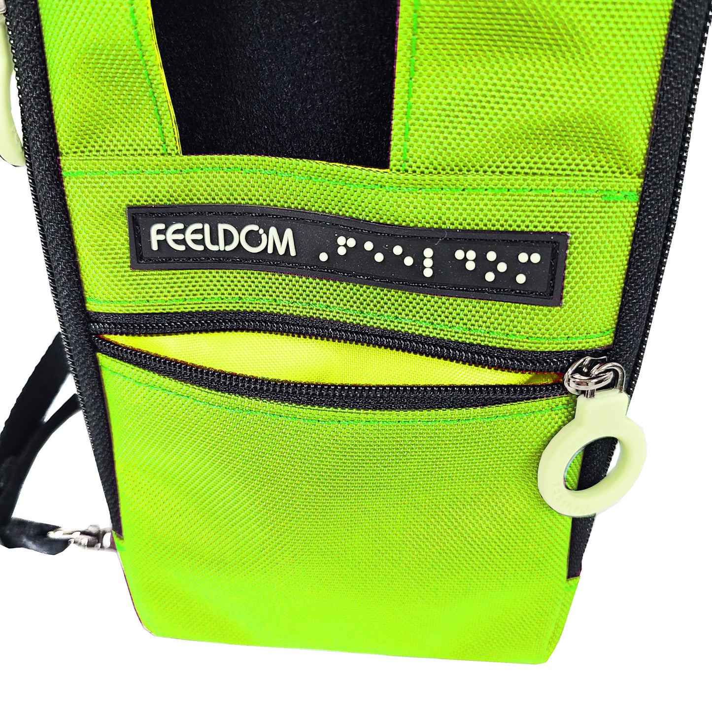 Close up of the Electric Kiwi (bright yellow-green) Navi Pal pouch. It is open to show the bright yellow lining. The small pocket is enough to put credit cards or earbuds or small objects into. The Braille FEELDOM logo tag is right above the zipper.